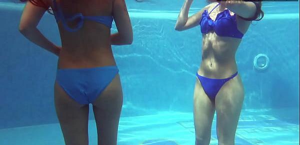  Two hot lesbian brunettes in the swimming pool